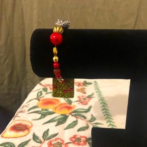 Handmade bracelet with a molding charms piece.